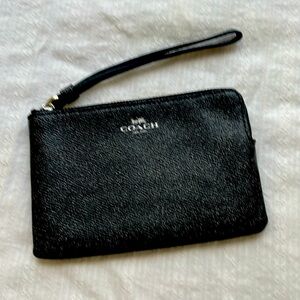 Black leather Coach wristlet.